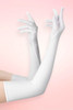 Long white spandex opera gloves in elbow length worn on both arms raised with fingers spread, against a pink background. 
