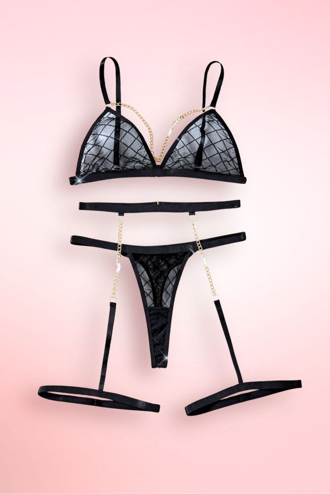 Black lace bra and garter belt lingerie set.