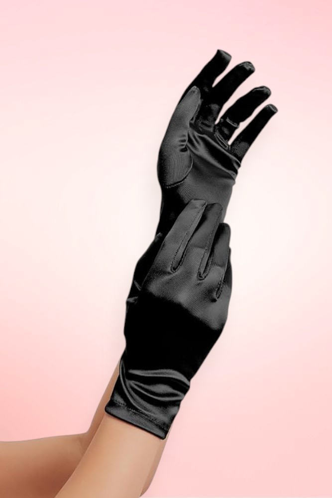 hort black satin wrist-length gloves worn on one hand, fingers spread upward, against a pink background.