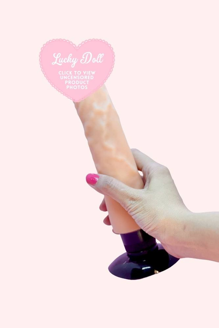 Jax Realistic Dildo Vibrator Soft Skin Feel with Strong Suction Cup Actual product photo held in hand for size comparison- censored tip