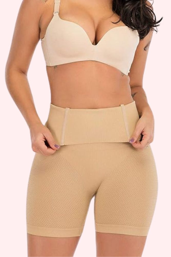 Voodoo Ultra High Waist thigh Shaper Compression in beige front view with model showing the boning at the waist