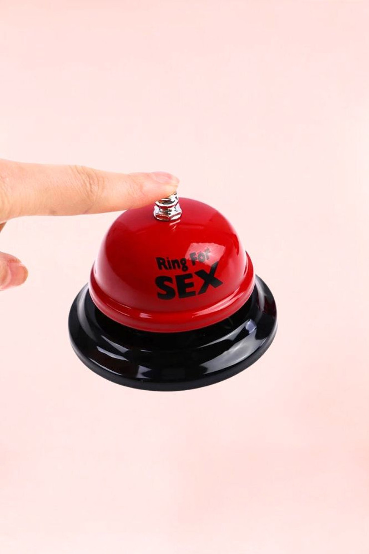 Ring for Sex Hand Bell actual product photo with finger pressing on the button
