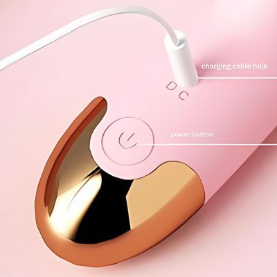 Dildo vibrator Gold luxurious base showing the charging cable hole and power button