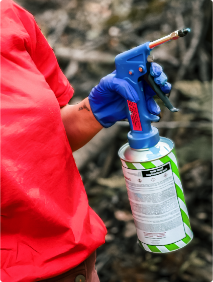 Person holding paint sprayer