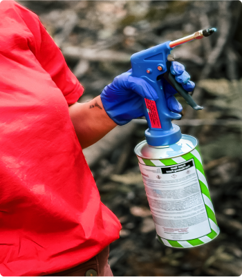 Person holding paint sprayer
