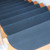 Grip-Tight Rubber Stair Treads on descending brown steps