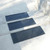 Angled view of concrete steps with Safety First Stair Mats