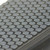 Zoomed-in texture of Coin-Grip Commercial (Grit Surface) Stair Tread