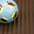 A Blue and black Soccer ball  on Fishbone-Pattern Rubber Flooring - 3rd view
