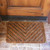 herringbone coir door mat in front of door