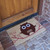 Angle view of Hooo's There? Owl Doormat in front of door