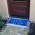 "Blue Sky Holiday Doormat" at door