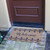 angle view of "Tropical Pineapple Doormat" at door