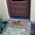 angle view of "Kitty Cat Welcome Mat" at door