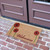 angle view of "Field of Red Daisies" - A Welcome Flower Mat at double doors