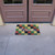 "The Colors of Autumn" - Checkerboard Fall Welcome Mat in front of double doors