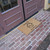 angle view of "Sweet and Loving Home!" - Natural Coir Home Sweet Home Doormat  at double doors