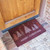 angle view of “Oh, Christmas Tree!” - Vibrant Red Christmas Welcome Mat at door