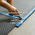 person cutting of black Diamond Plate Rubber customized mat