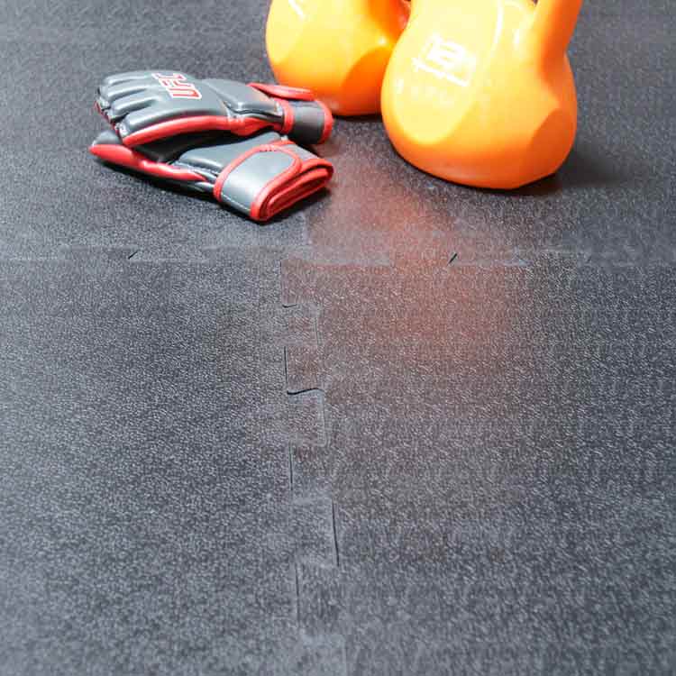 Armor Lock Tile Floor with Orange Kettlebells and Weightlifting gloves on top