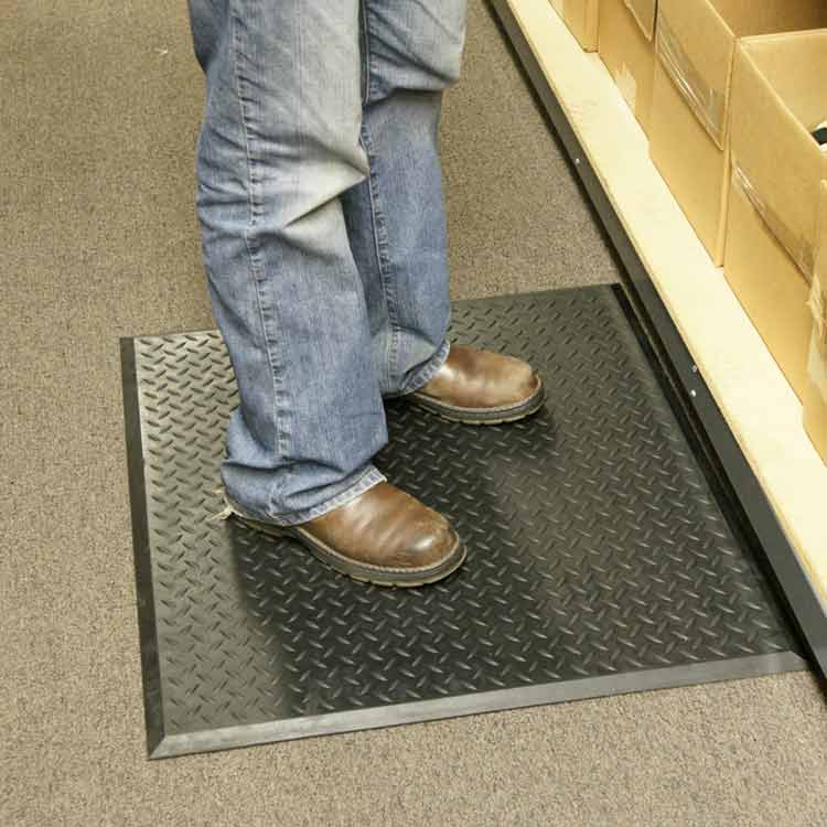 person standing on black foot rest in a room