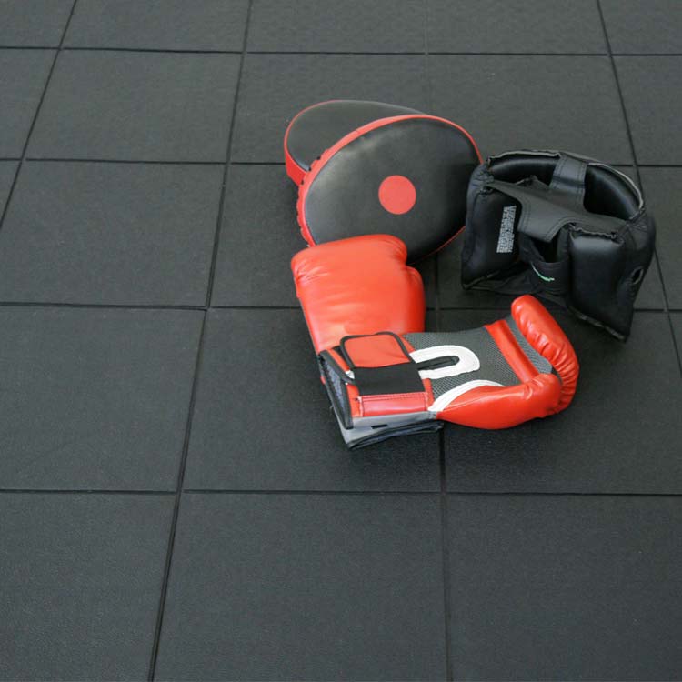 Boxing gloves and training equipment on Revolution Interlocking Tiles