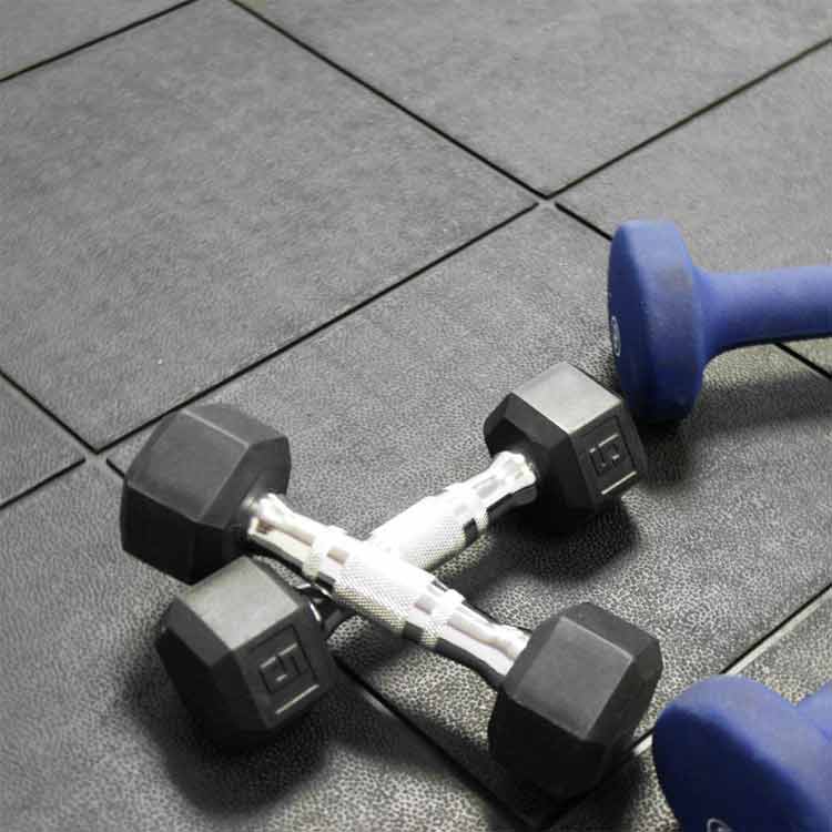 black revolution interlocking tiles on fitness equipment room