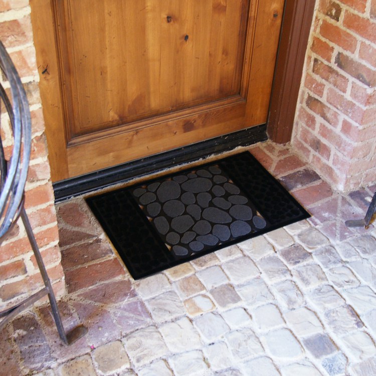 Doormat with a river rock pattern in front of a door