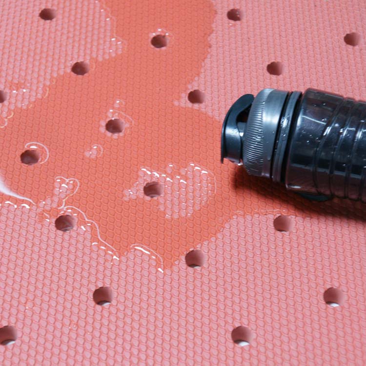 spilled water on red soft cloud drainage antislip mat