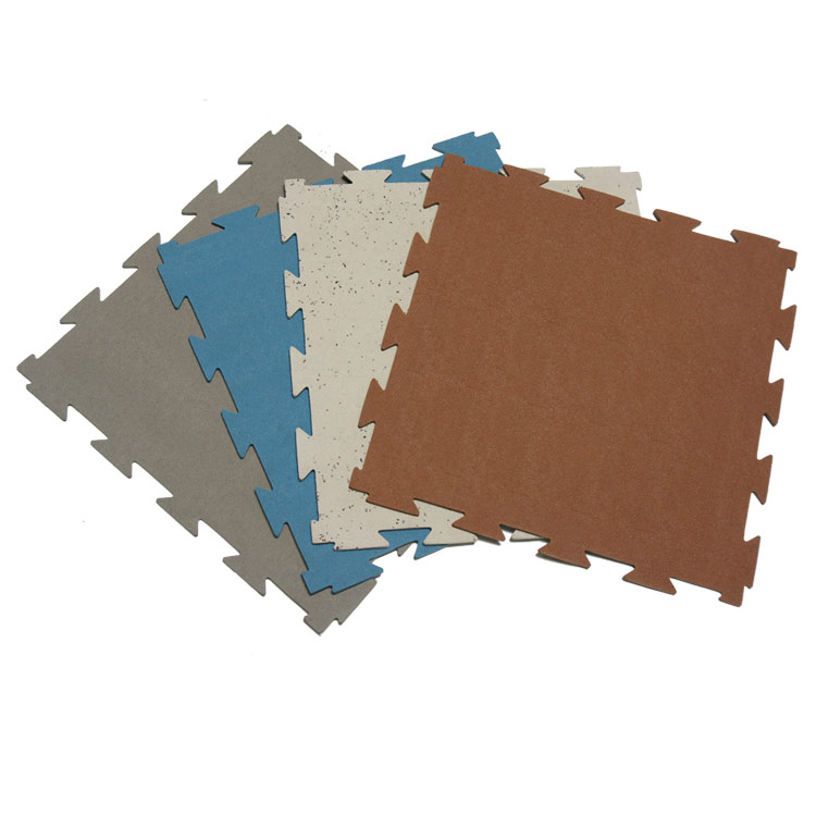 Four colored Terra Flex Rubber Tiles fanned out