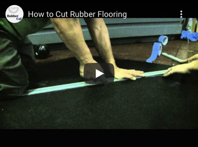 Video Thumbnail How to Cut Rubber Mats A person holding a ruler and utility knife ready to cut rubber