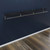 Wall-Mounted Black Wooden Shelf with Heavy Duty Hanging Rail Kit on Display Wall