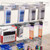 3 x Double Sided In-Queue Merchandising Bays with Magazine Shelves and Hooks, Bin, 2 Bowls and Header Frame
