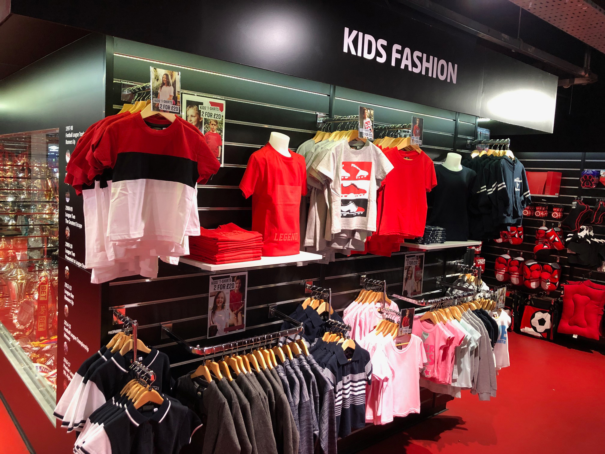 Children's clothing on display in a sports shop