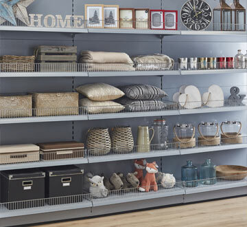 Shelfs in a convience store, lined up with products.