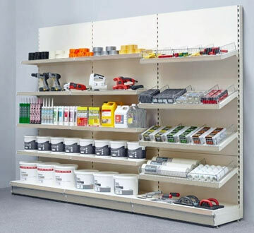 Shelfs in a convience store, lined up with products.