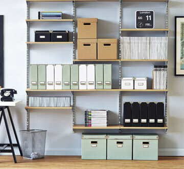  Wall mounted twin slot shelving, with boxes, and magazines at the top 