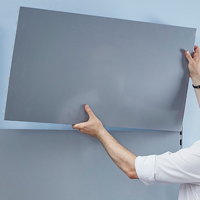 A person assembling a shelving unit