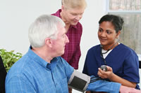 Woman Checking Man's Blood Pressure