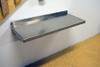aluminum fold down work table mounted to garage wall