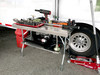 metal folding table at a race track with tools on it