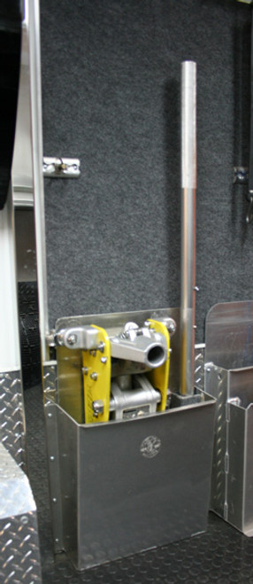 aluminum floor jack holder mounted on wall inside an enclosed trailer