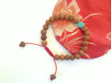  Tibetan Mala Raktu seed wrist mala/ bracelet with Turquoise spacer 