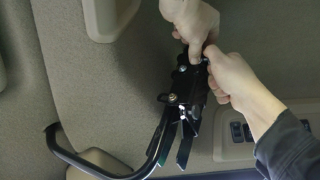 Installing the Vehicle Kit which is two metal stud on the cab bracket in a John Deere Combine cab.