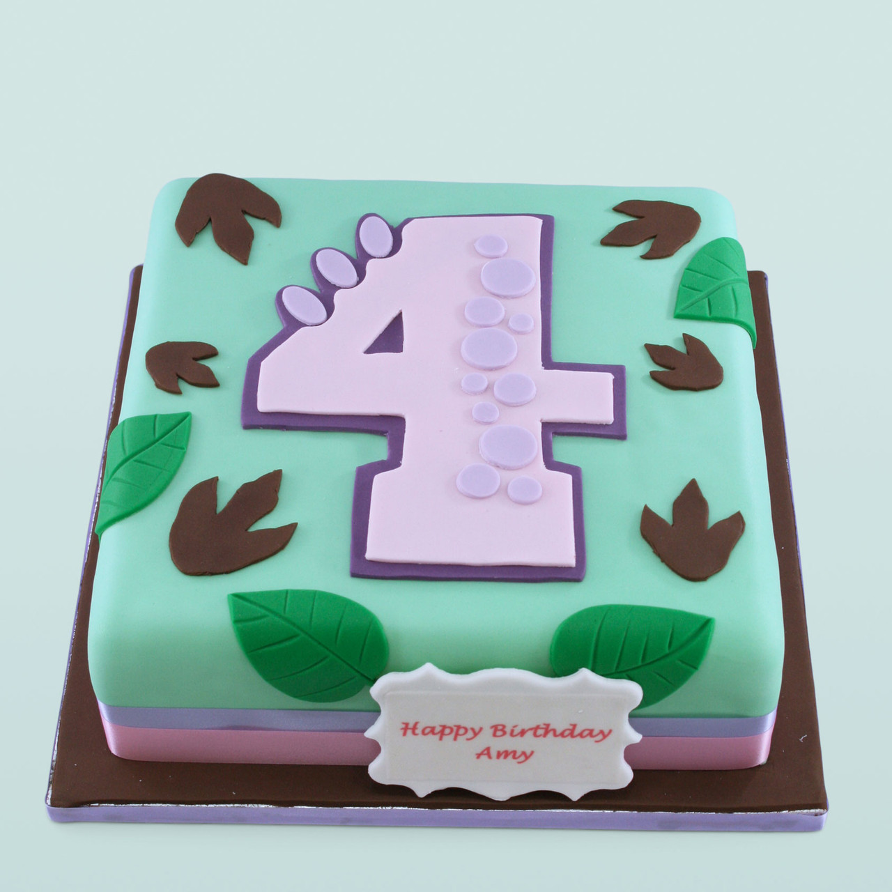 Baby Dinosaur Cake | Oregon Dairy Bakery #629 tags: green, ribbon, pink,  bow, layered, girl, shower | Dinosaur cake, Dinosaur birthday cakes, Dino  cake