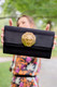 Lisi Lerch Avery Fold Over Black Woven Clutch With Lion Door Knocker 