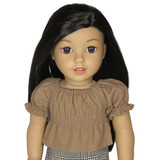 Fits 18" dolls
Includes: top
Woven crop Saga top with shirred bodice. Elasticized neck and cuffs. Short sleeves. Velcro closure in back.
Fabric: 100% cotton.
Color: light brown