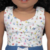 Fits 18 inch dolls
Includes: top
Woven top with ruched front. Velcro closure in back.
Color: white with floral print
Fabric:  100% cotton