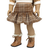 Fits 18" dolls
Includes: skirt
Mini skirt with ruffle. Elastic waist.
Fabric: 100% cotton
Color: brown and white plaid