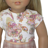 Fits: 18" dolls
Includes: top
Upcycled knit top with short sleeves and Velcro closure in back. Boho floral design.
PLEASE NOTE: the design placement will vary on each shirt.
Color: white, pink, orange, yellow
